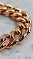 Close-up view of an elegant gold chain featuring sparkling diamond accents displayed on a smooth surface photo
