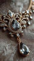Elegant vintage necklace with intricate design and sparkling gemstones displayed on a textured fabric background photo
