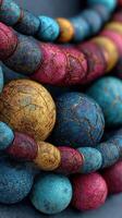 Colorful textured beads arranged in an artistic display showcasing vibrant patterns and intricate details in an abstract setting photo