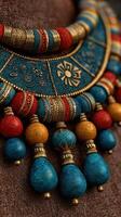 Colorful handcrafted necklace showcasing intricate designs with vibrant beads displayed on textured fabric photo