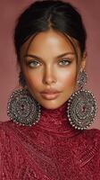 Elegant portrait of a woman wearing large silver earrings and a richly patterned burgundy dress in a stylized setting photo
