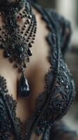 Elegant black lace and jewelry create a striking look at an indoor fashion showcase in the afternoon light photo