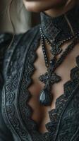 Intricate black gothic necklace worn with an elegant lace dress in a softly lit setting photo
