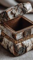 Rustic birch wood box with detailed carvings, perfect for storing small treasures or keepsakes photo