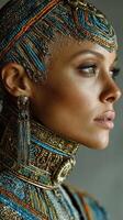 Detailed close-up portrait of a model showcasing intricate beaded jewelry and costume design against a neutral backdrop photo