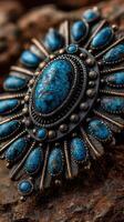 Intricate turquoise jewelry resting on textured stone, showcasing detailed craftsmanship and vibrant color contrast photo