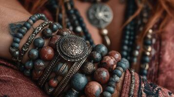Hand adorned with an array of colorful jewelry showcasing intricate designs at an artisan market photo