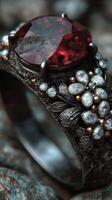 Exquisite jewelry ring featuring a large ruby gemstone and intricate floral design in natural light setting photo