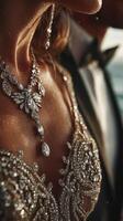 Elegant evening attire showcases intricate beadwork at a romantic seaside event during sunset photo