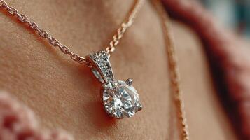 Stunning diamond pendant jewelry worn on a delicate chain displayed in soft lighting photo