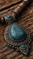 Beautiful silver jewelry with turquoise stone on rustic wooden background for artisanal display photo