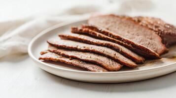 Tender Sliced Beef Brisket on a White Plate photo