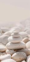A stack of white rocks on a beach photo