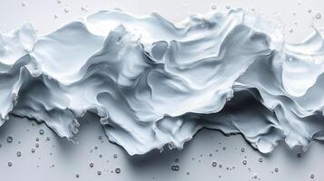 A white wave with a lot of foam and water droplets photo