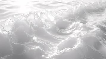 The image is of a large body of water with white foam and waves photo