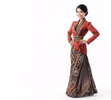 A woman in a red and black dress is posing for a photo