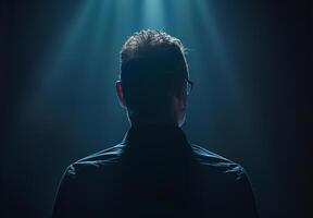 The Enigma of the Silhouetted Figure in a Spotlight's Embrace photo