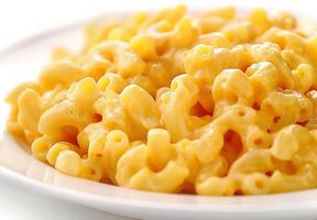 A plate of yellow macaroni and cheese photo