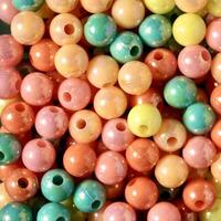 Close up colorful round beads diy craft objects isolated on square full frame background from top angle view. photo