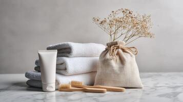 Towels, toothbrush and toothpaste on marble counter photo