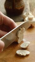 Vertical . Slicing mushrooms champignons on chopping board video