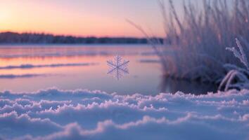Snowflake Floating Over Frozen Lake at Sunset with Snowy Foreground photo