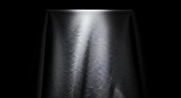 Black cloth on a black background photo