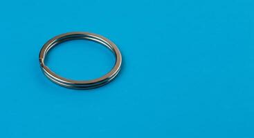 A ring on a blue background with a white background photo