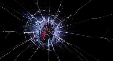 A broken glass window with a red heart on it photo