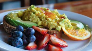 A plate of food with fruit and a sandwich photo