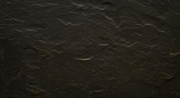 A black stone wall with some scratches on it photo