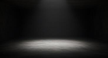 Dark room with light coming from the ceiling photo