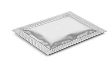 A silver packet of medicine on a white background photo