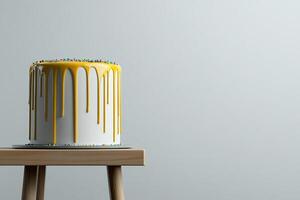 A cake with yellow icing on top of a wooden stand photo