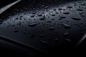 A close up of a car with water droplets on it photo