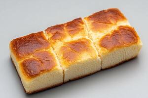 A piece of bread with a square cut in it photo