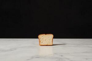 A piece of bread sitting on a table photo