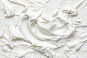 A close up of white frosting on a white surface photo