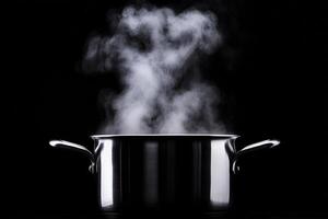A pot with steam coming out of it on a black background photo