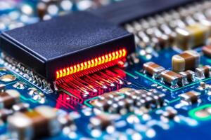 A close up of a circuit board with a red led photo