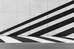 A black and white photo of a wall with shadows