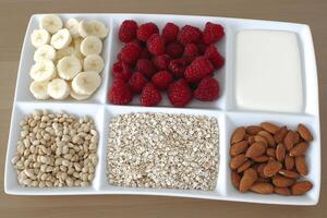 A white plate with a variety of fruits and nuts photo
