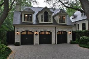 A large garage with two black doors photo