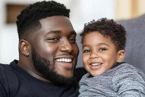 A man and a young boy are smiling photo