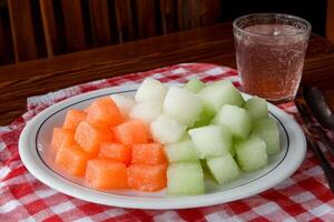 A plate of watermelon cubes photo