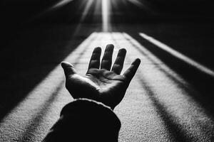 A person reaching out to the sun photo