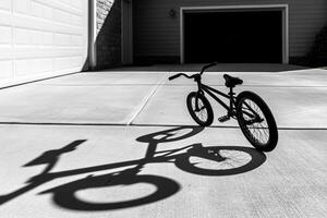 Shadow of a bicycle on the driveway photo