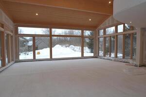 A large room with lots of windows and a lot of snow photo