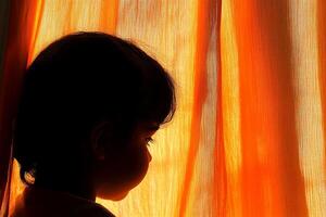 A child looking out a window photo