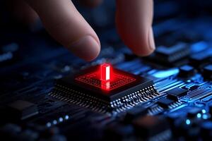 A person touching a red button on a computer motherboard photo